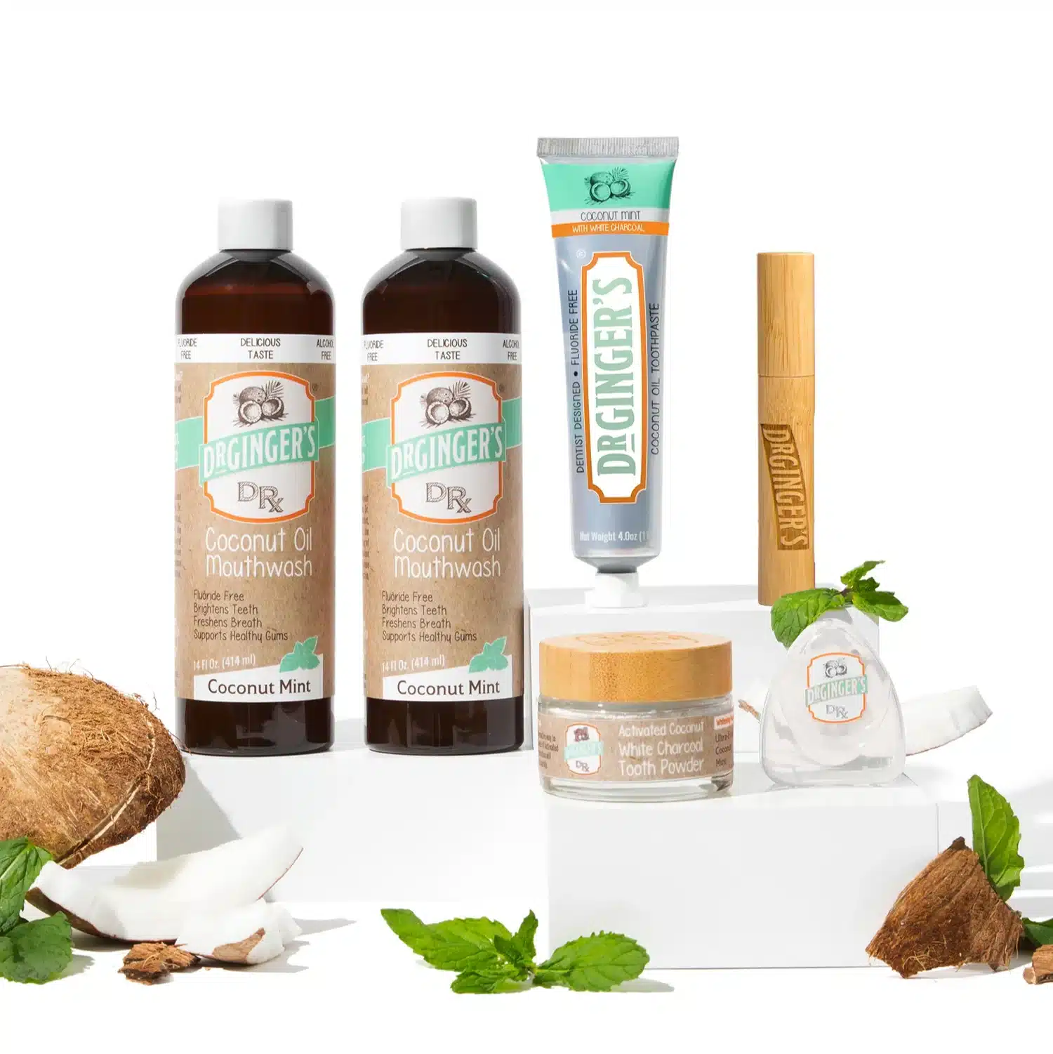 Vibrant natural oral care products featuring coconut oil and xylitol on bathroom counter with natural wood accents and plants